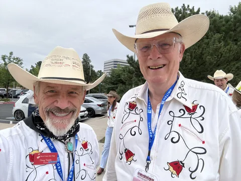 Doug Tisdale with community supporters at an outdoor event
