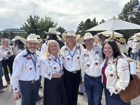 Doug Tisdale with community supporters at an outdoor event